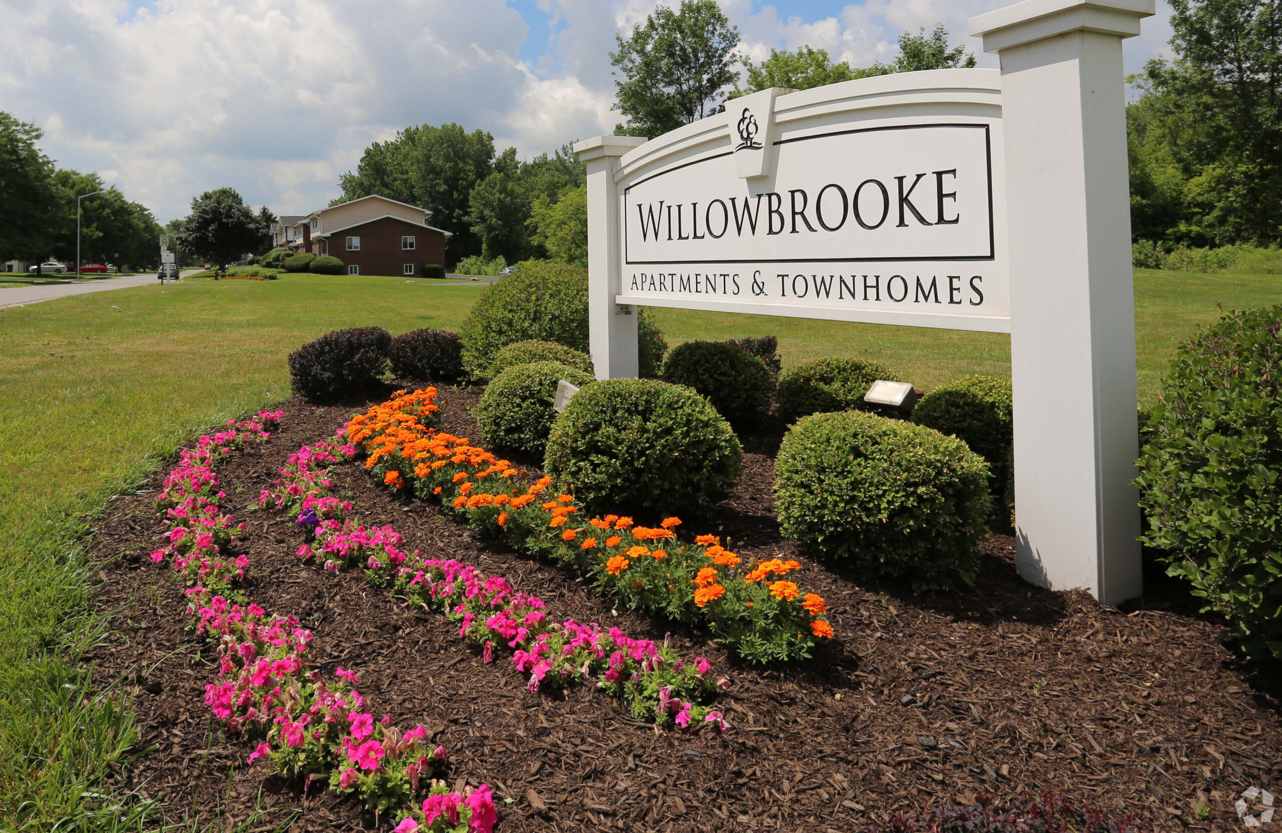 Willowbrooke apartments and townhomes sign